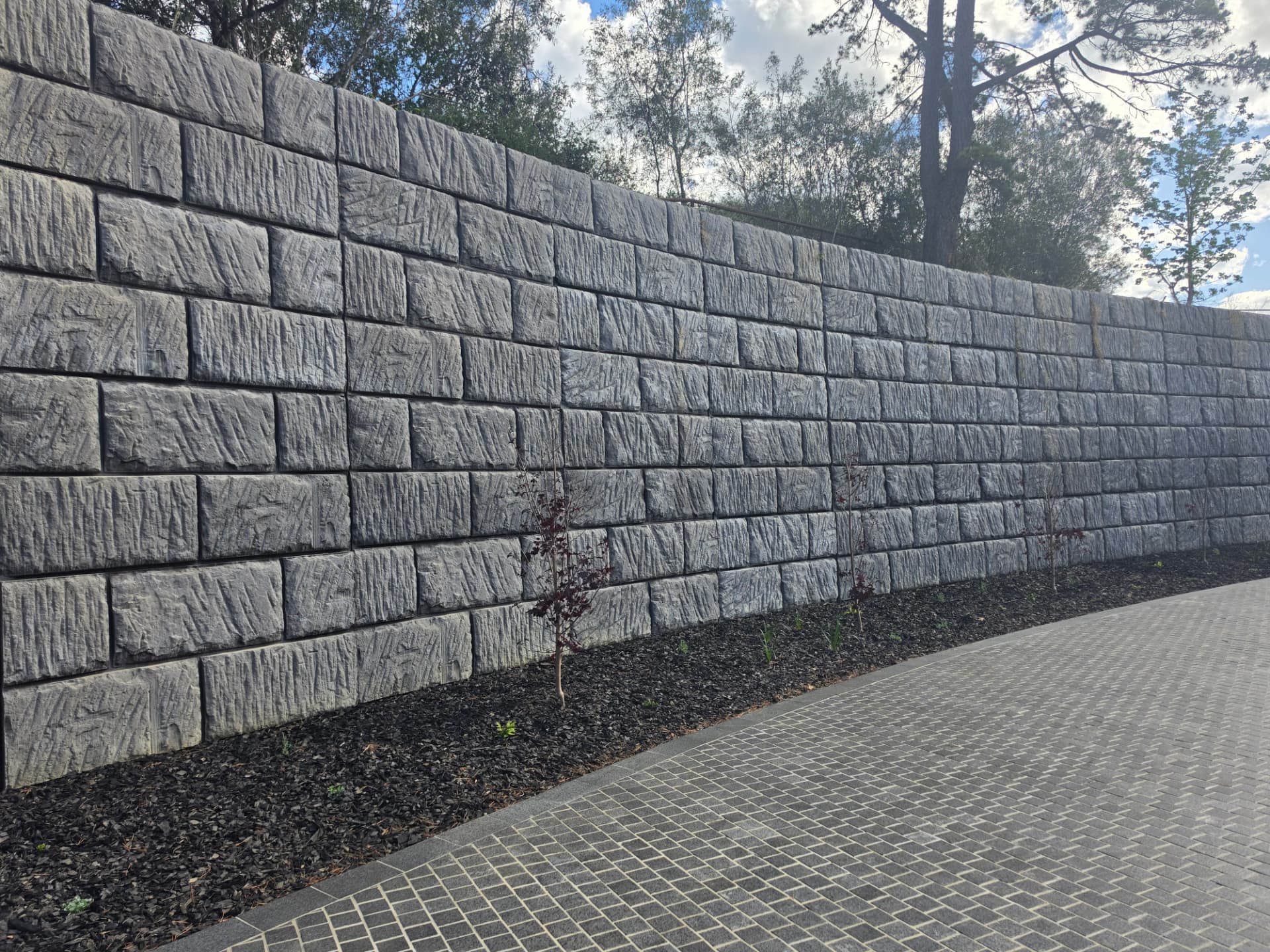 Sandstone log wall · Charcoal