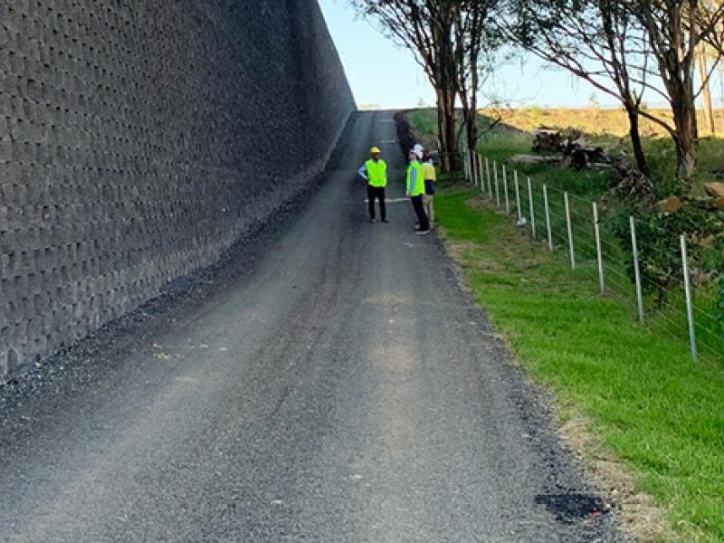 Concrete block retaining wall alongside an access path