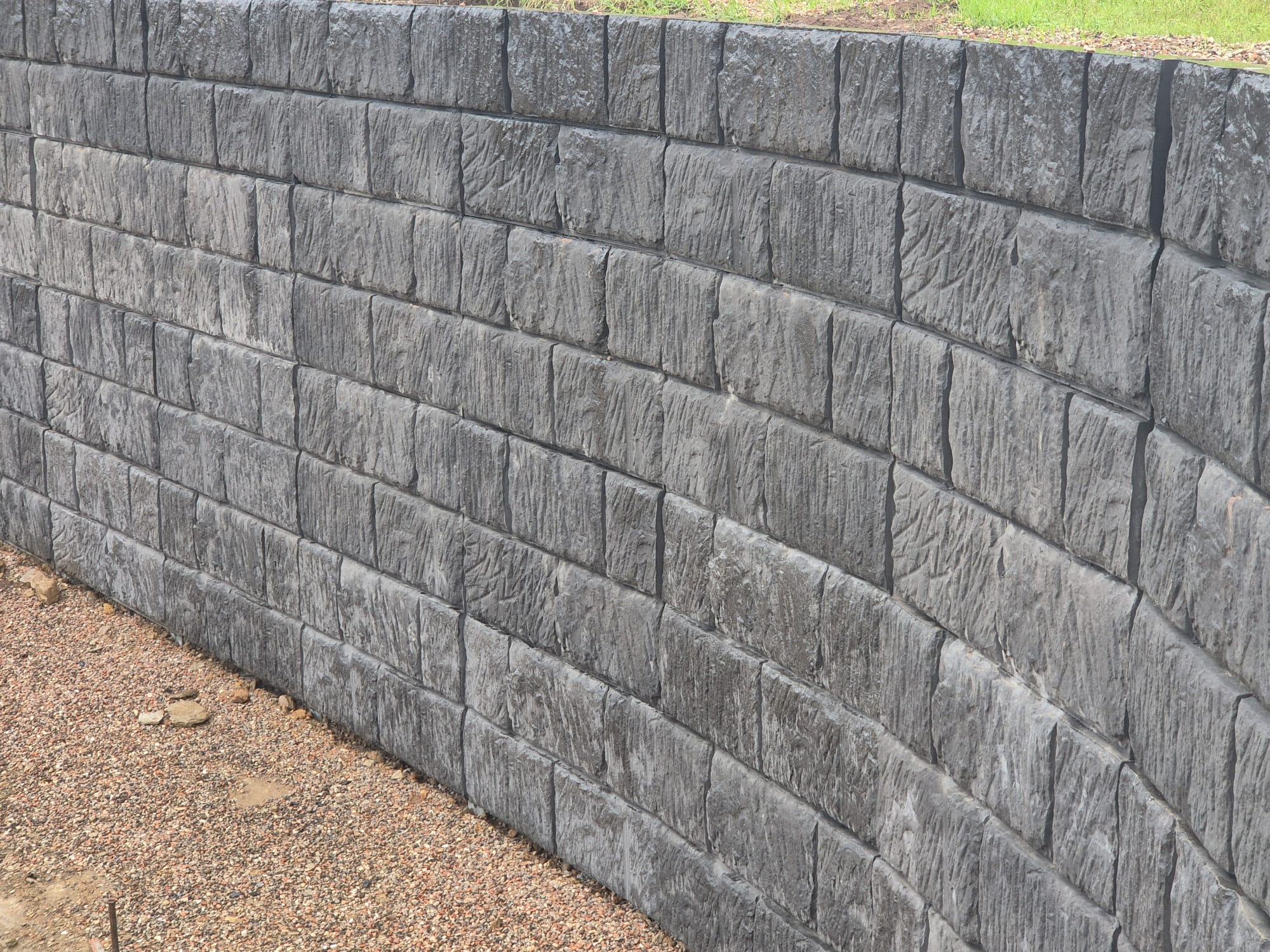 Sandstone Log · Charcoal precast concrete panel finish
