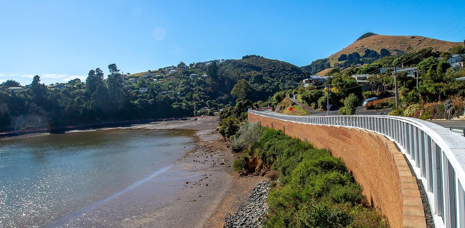 Concrete block retaining wall beside a waterside civil access route